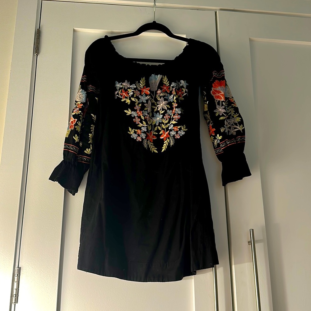 Airy black dress with beautiful flower embroidery from free people.